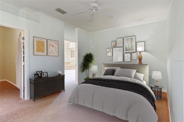 carpeted bedroom with ornamental molding, connected bathroom, and ceiling fan