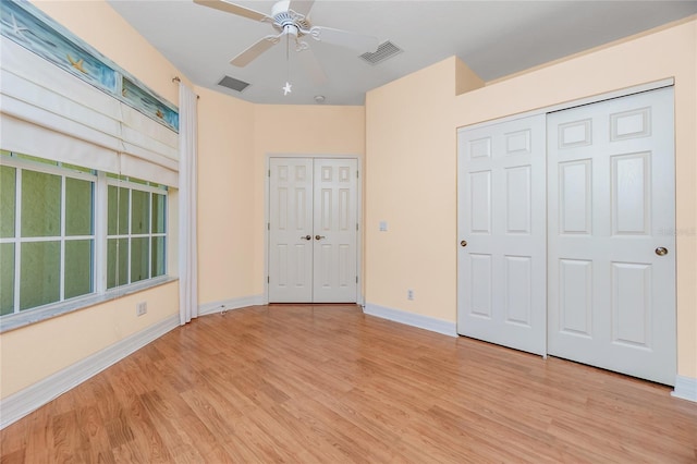 unfurnished bedroom featuring ceiling fan and light hardwood / wood-style flooring