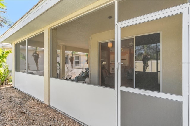 view of patio featuring a sunroom