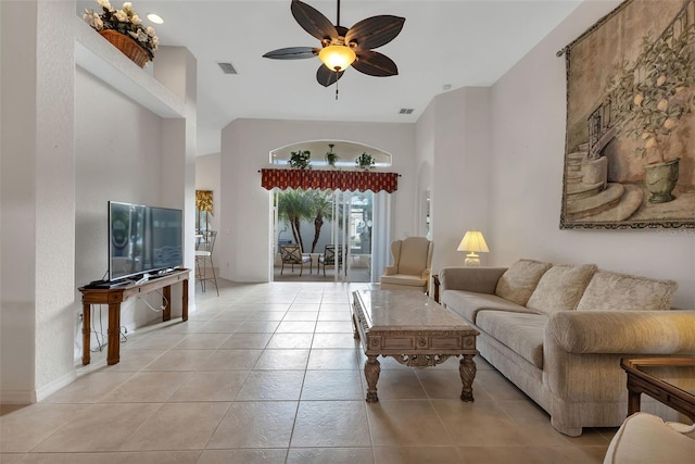 living room featuring light tile flooring and ceiling fan