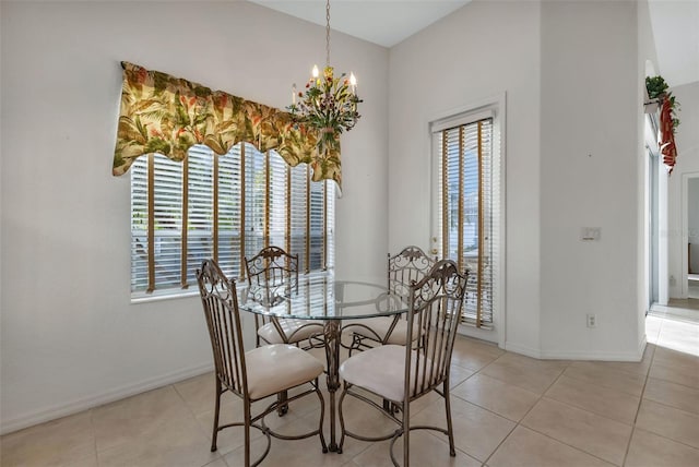 tiled dining space with a notable chandelier and a wealth of natural light