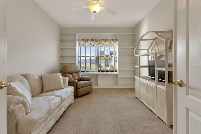 living room with light carpet and ceiling fan