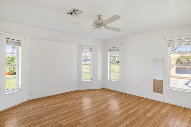 unfurnished room with ceiling fan and light hardwood / wood-style floors