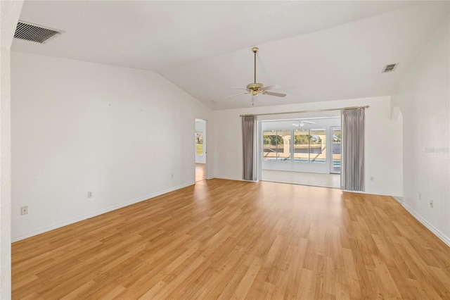 empty room with ceiling fan, light hardwood / wood-style flooring, and lofted ceiling