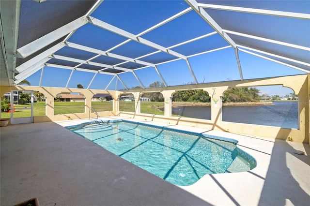 view of swimming pool with glass enclosure and a patio