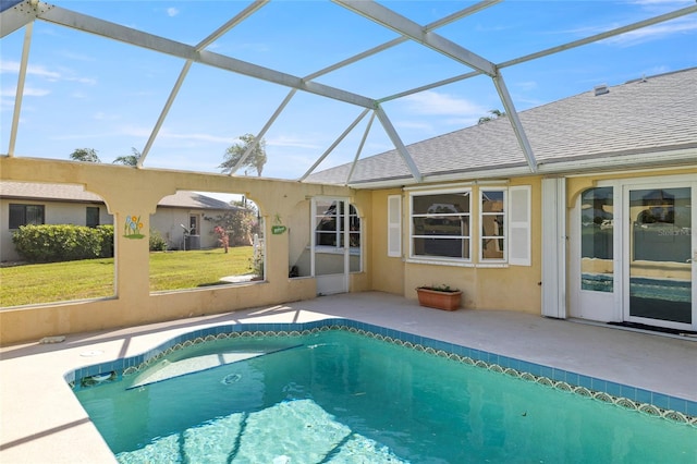 view of swimming pool with a lanai and a patio area