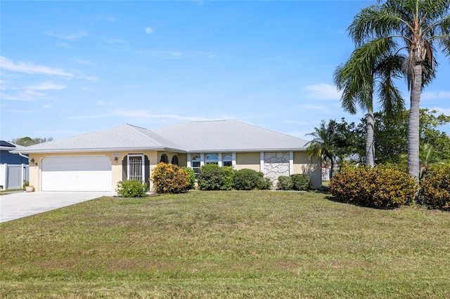 ranch-style home with a front yard and a garage