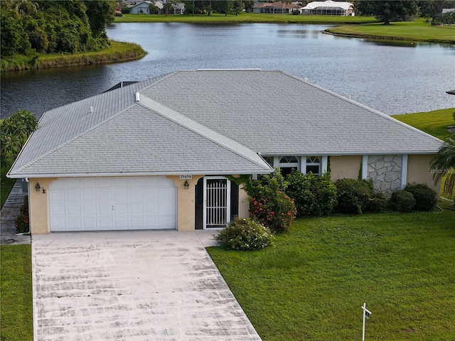 ranch-style home with a water view and a front yard