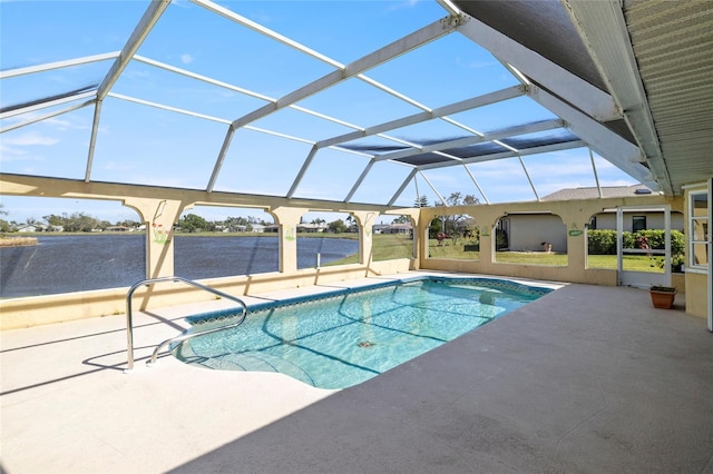 view of pool featuring glass enclosure and a patio