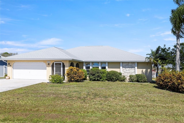 ranch-style house with a garage and a front yard