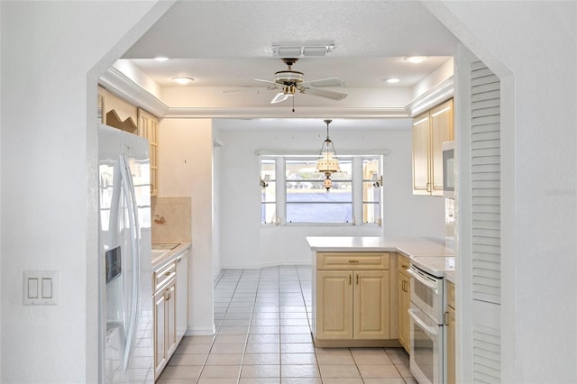 kitchen featuring light tile patterned floors, ceiling fan, stainless steel fridge with ice dispenser, stove, and kitchen peninsula