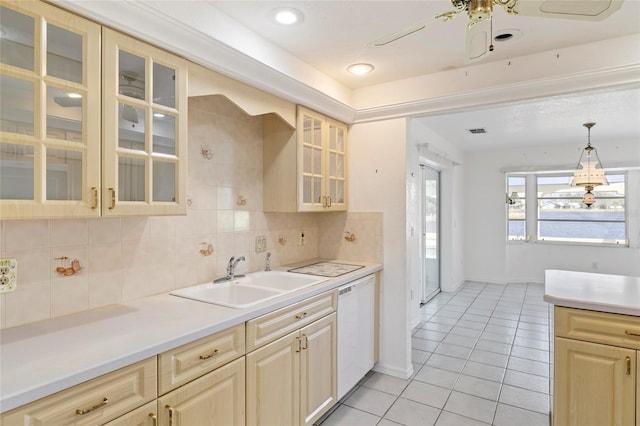 kitchen with backsplash, sink, pendant lighting, light tile patterned floors, and ceiling fan