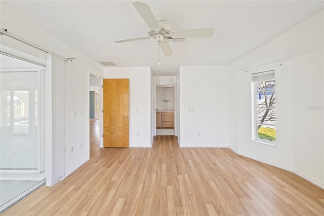 empty room featuring light wood-type flooring and ceiling fan