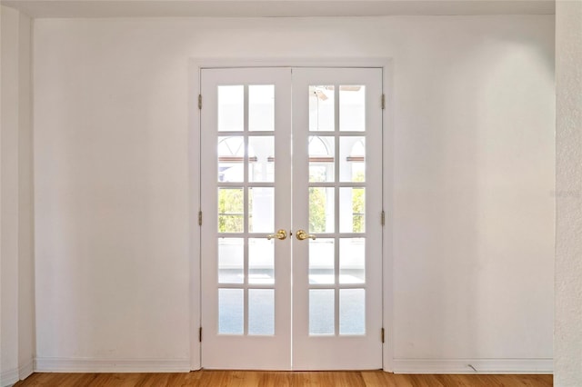 doorway featuring light hardwood / wood-style flooring and french doors