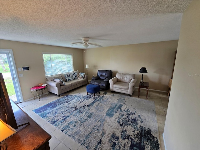 21427 Michigan Ave, Port Charlotte, FL 33952 - living room featuring tile patterned flooring, a textured ceiling, and ceiling fan