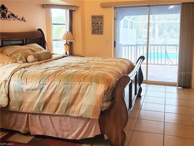 tiled bedroom featuring access to outside