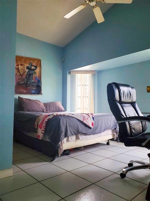 tiled bedroom with vaulted ceiling and ceiling fan