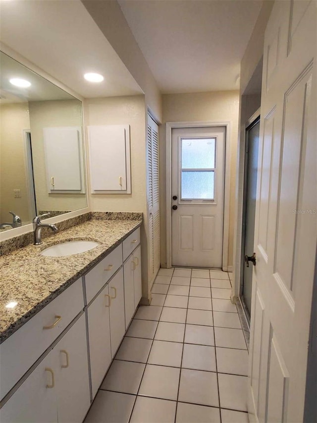 bathroom featuring vanity and tile patterned flooring