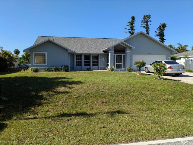 single story home featuring a garage and a front lawn