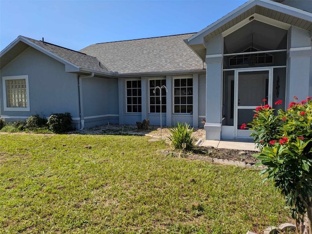 view of side of property with a yard