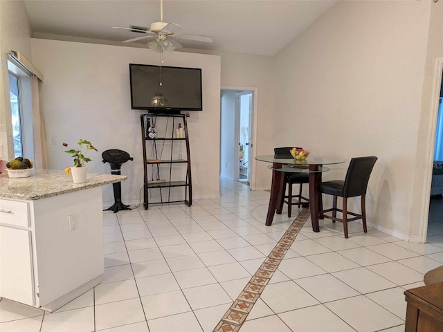 tiled dining room with ceiling fan