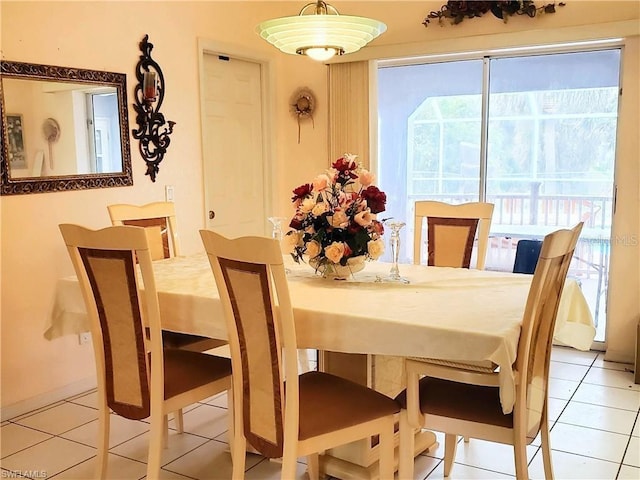 dining area with light tile patterned floors