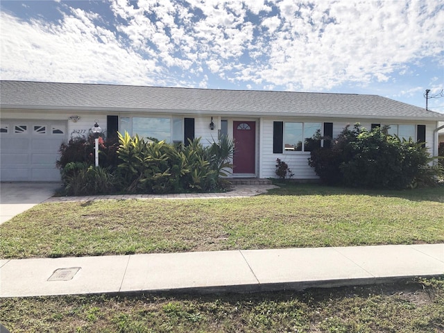 single story home with a front lawn and a garage