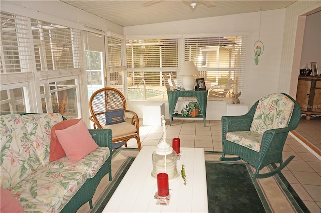 sunroom / solarium with ceiling fan and vaulted ceiling