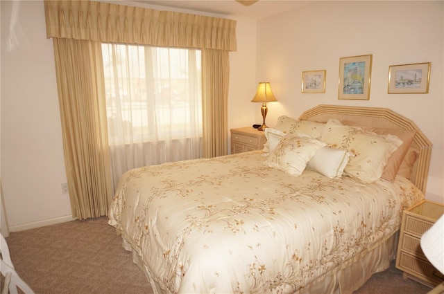 bedroom featuring dark colored carpet