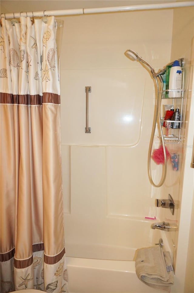 bathroom featuring shower / bath combination with curtain