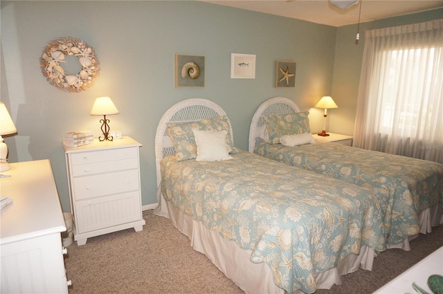 bedroom with light carpet and ceiling fan