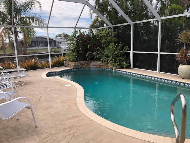 view of pool featuring a patio and a lanai