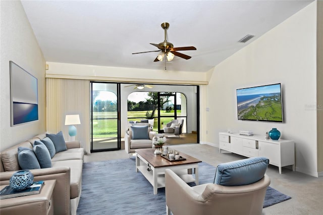 carpeted living room featuring ceiling fan and lofted ceiling