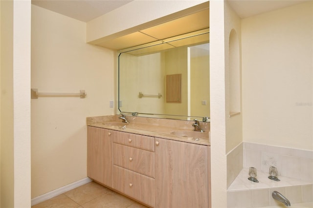 bathroom with a bath, double sink, tile floors, and large vanity