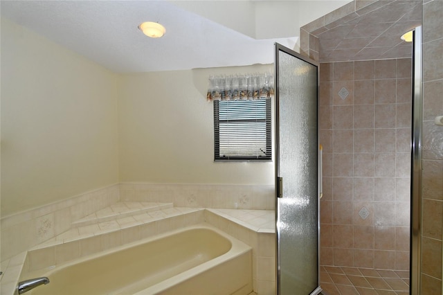 bathroom with shower with separate bathtub