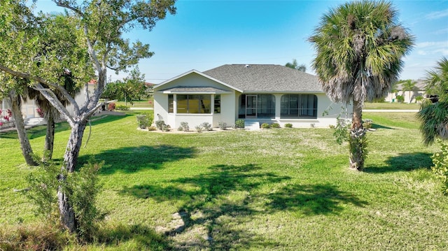 ranch-style house with a front lawn