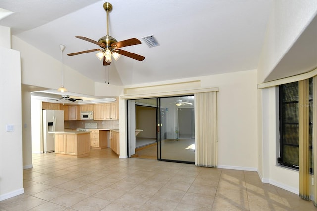 spare room with high vaulted ceiling, light tile flooring, and ceiling fan