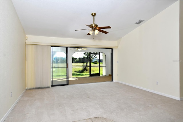 unfurnished room with light colored carpet and ceiling fan