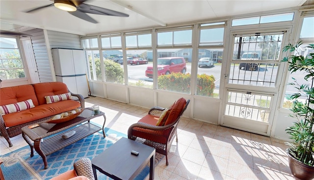 sunroom with a healthy amount of sunlight and ceiling fan