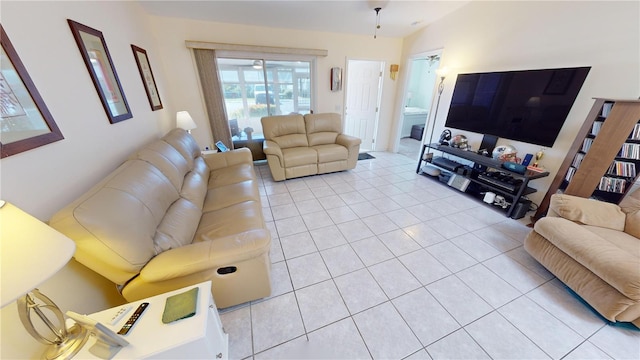 living room with light tile flooring and lofted ceiling