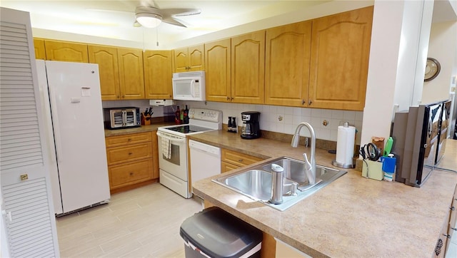 kitchen with light tile floors, ceiling fan, white appliances, backsplash, and sink