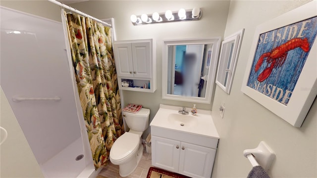 bathroom with toilet, tile flooring, walk in shower, and vanity