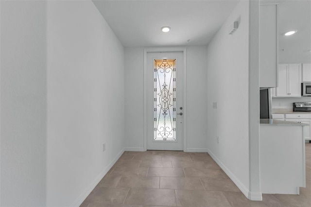 entryway featuring light tile patterned floors