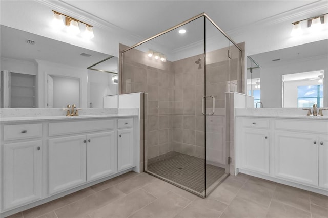 bathroom with vanity, a shower with shower door, ornamental molding, and ceiling fan