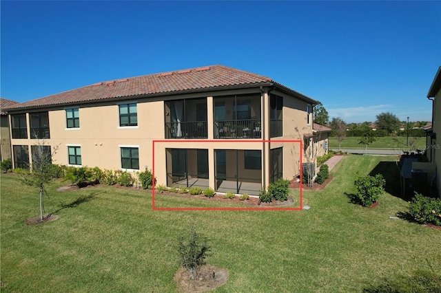 back of house with a yard