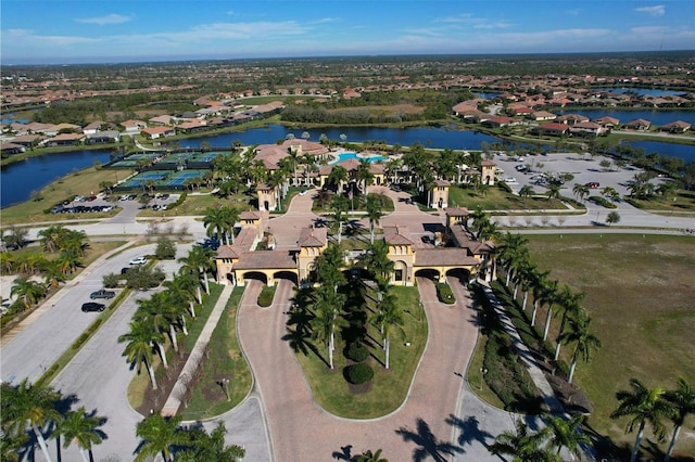 birds eye view of property with a water view