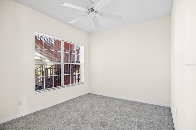 empty room featuring carpet and ceiling fan