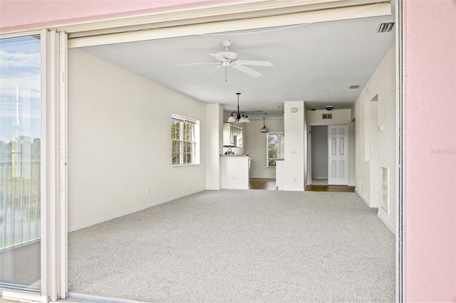 carpeted empty room with ceiling fan