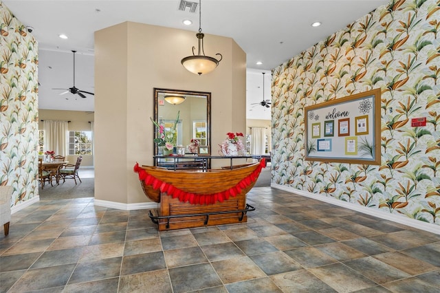 dining room featuring dark colored carpet, a high ceiling, and ceiling fan