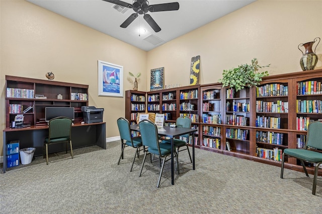 carpeted office space with ceiling fan